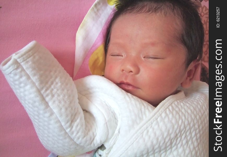 Sleeping Baby on a bed