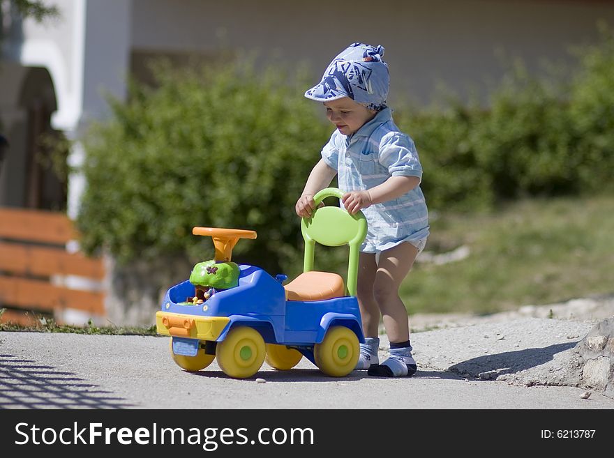 Happy and small boy with car in summer. Happy and small boy with car in summer