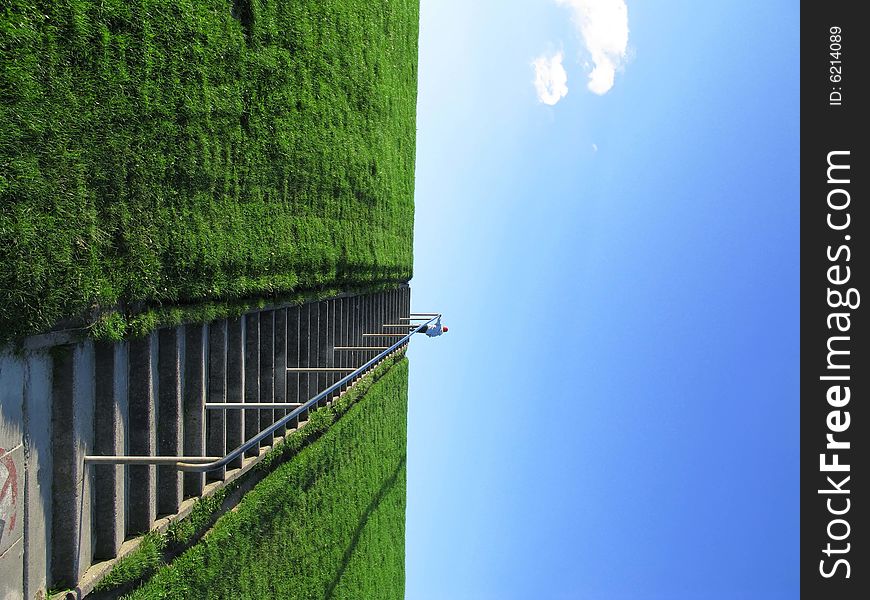 Young boy on a stairway to heaven with cloud