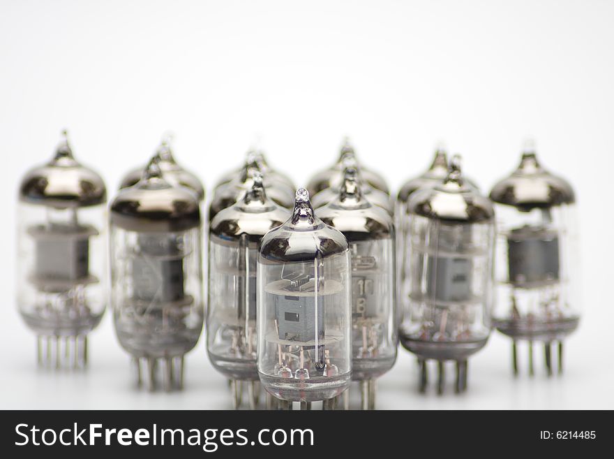 Row of old lamps on white background