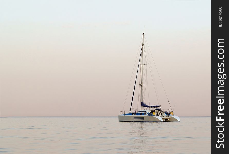 Sailboat in sailing on wide open sea