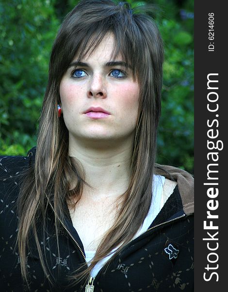 A portrait of a beautiful white caucasian girl teenager with a worried expression on her face. A portrait of a beautiful white caucasian girl teenager with a worried expression on her face