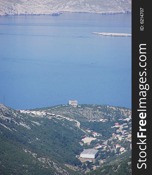 Croatia - view from the Velebit Mountain (Vratnik Pass) to the Adriatic Sea and Kvarner Bay the town Senj and Nehaj Fortress and the island of Krk in the background *RAW format available. Croatia - view from the Velebit Mountain (Vratnik Pass) to the Adriatic Sea and Kvarner Bay the town Senj and Nehaj Fortress and the island of Krk in the background *RAW format available