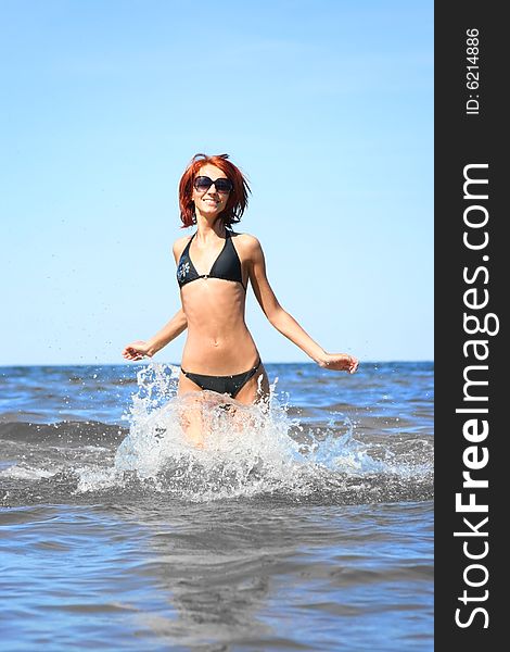 Beautifil girl running on the sea. Beautifil girl running on the sea