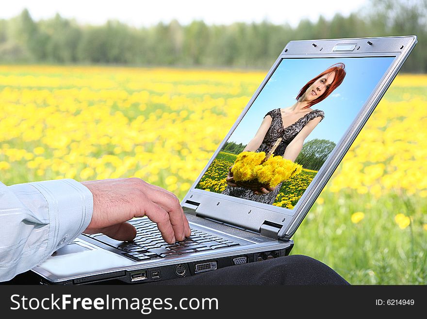 Laptop with picture of beautiful girl on desctop