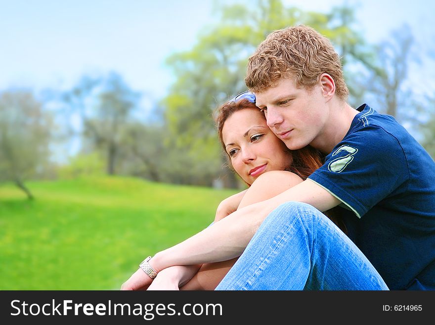 Happy young couple relaxing outdoors. Happy young couple relaxing outdoors