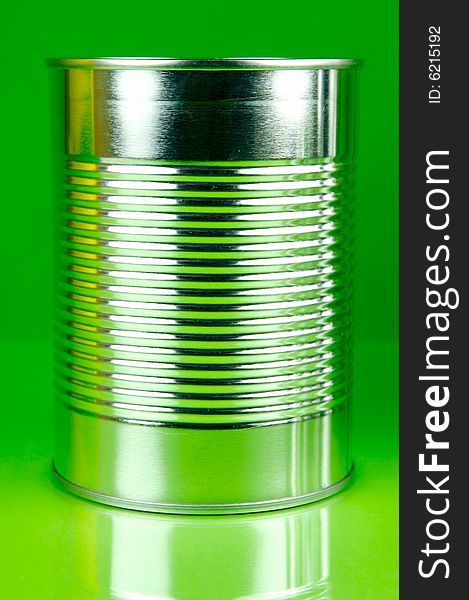 Assorted tins isolated against a green background. Assorted tins isolated against a green background