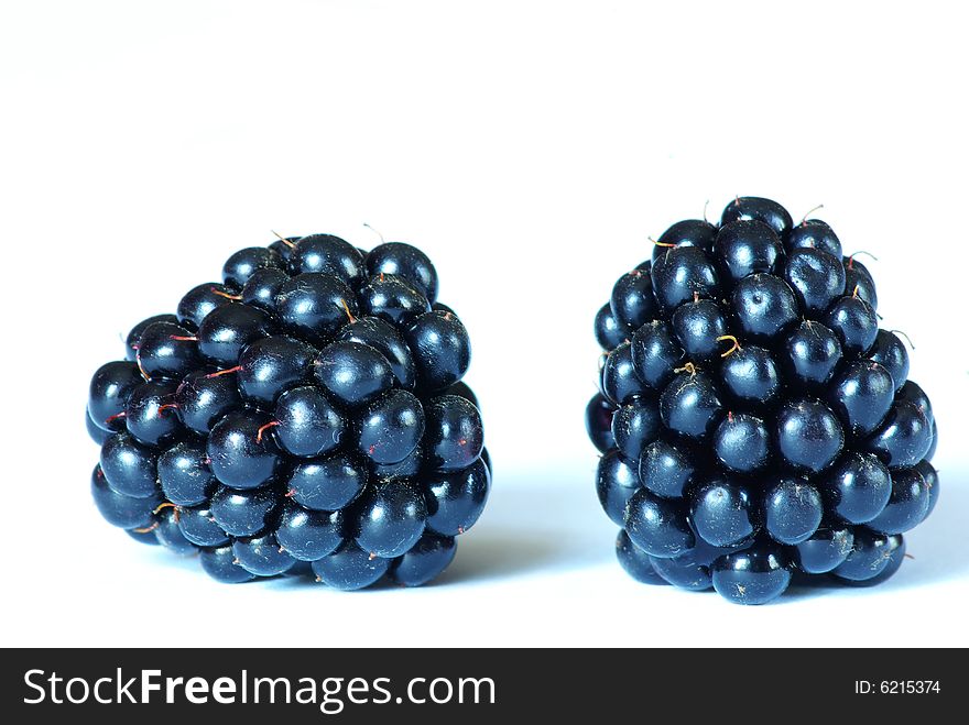 Two of blackberries isolated on white background.