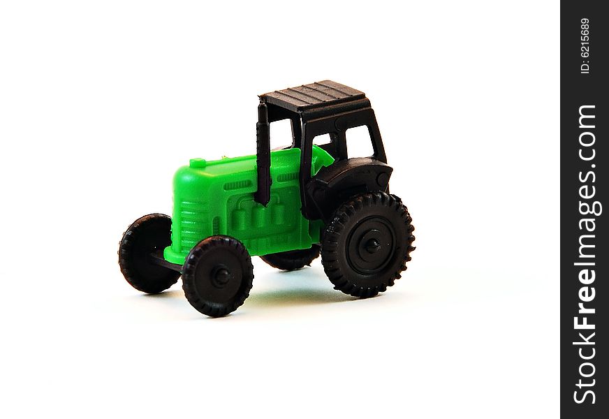 A small green toy tractor