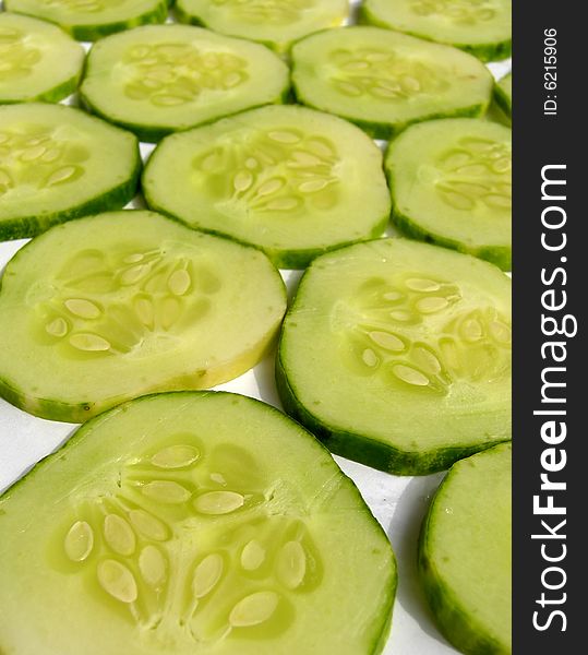 Cut cucumber big slices background