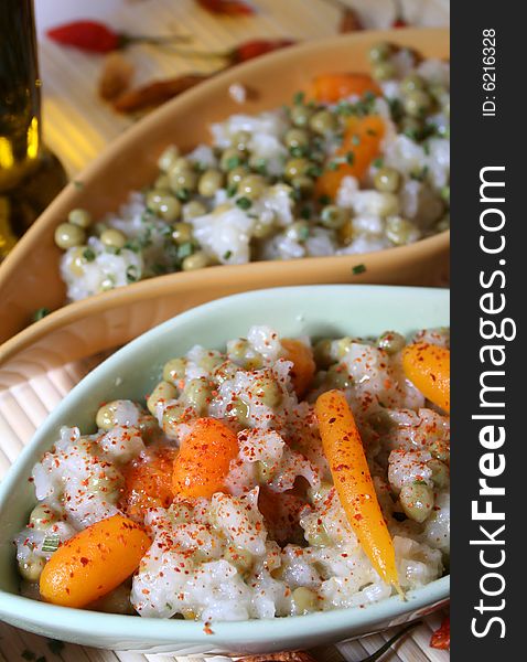 Salad of rice with some carrots and peas