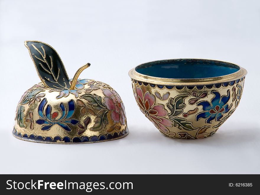 This is the colse-up of a small art pot. It is made in Chinese traditional cloisonne technical. This is the colse-up of a small art pot. It is made in Chinese traditional cloisonne technical.