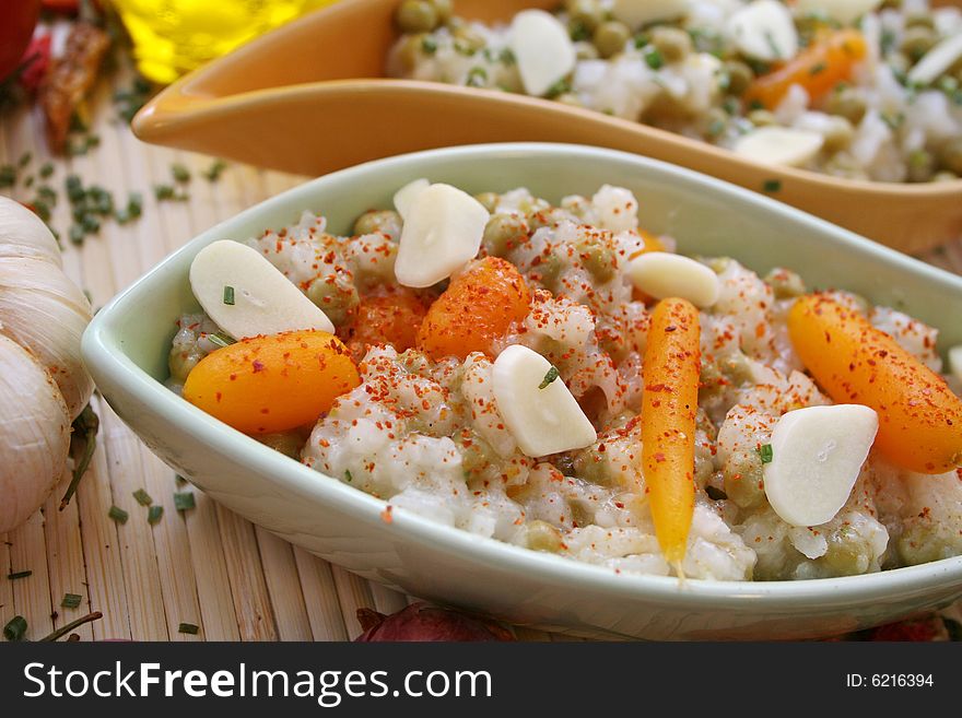 Salad of rice with some carrots and peas