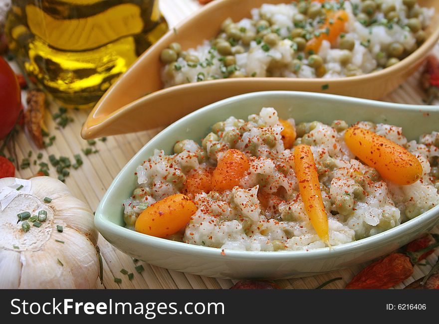 Salad of rice with some carrots and peas