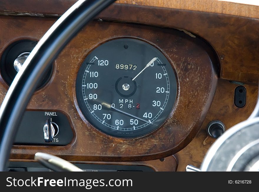 Main view of an old wooden framed speedometer