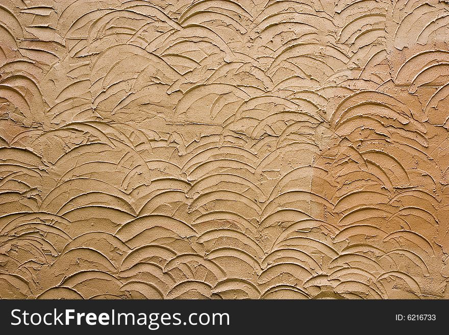 A design in brown stucco for backgrounds or texture. A design in brown stucco for backgrounds or texture