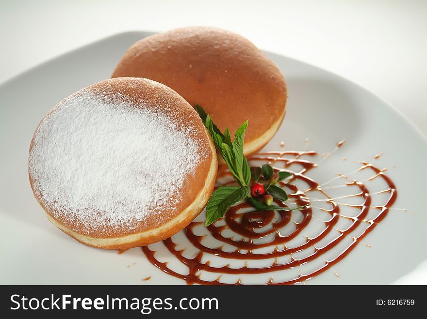 Doughnuts with jam and sugar