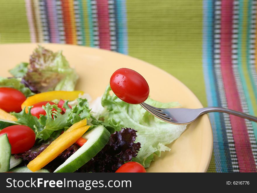 Fresh colorful salad with cherrie tamatoes and cucumber. Fresh colorful salad with cherrie tamatoes and cucumber