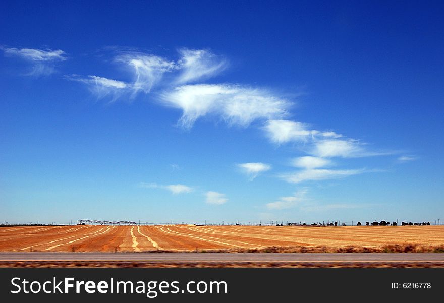 Golden wheat field, blue sky and clouds. Golden wheat field, blue sky and clouds