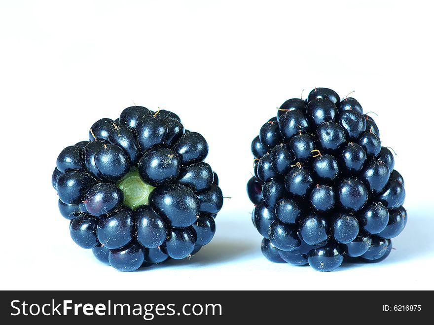 Two of blackberries isolated on white background.