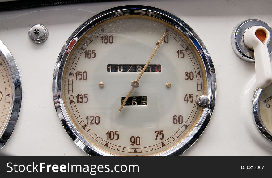 Some litle dials and knobs on an old sheet steel dashboard. Some litle dials and knobs on an old sheet steel dashboard