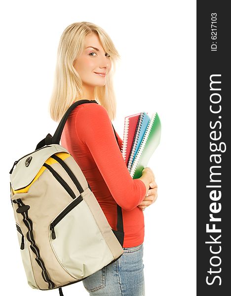 Attractive teenage girl with notebooks isolated on white background