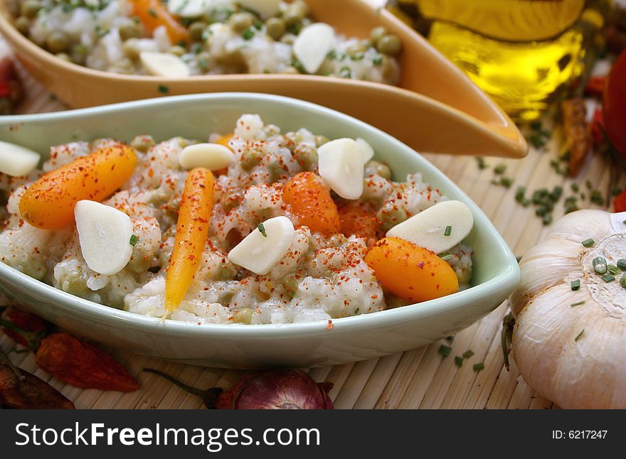 Salad of rice with some carrots and peas