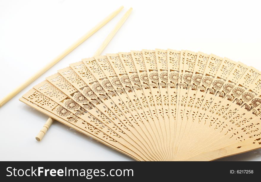 Culture of China, sticks and fan on a white background. Culture of China, sticks and fan on a white background