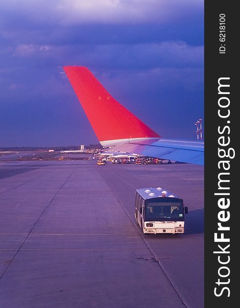 Bus on runway in a beautiful sunset