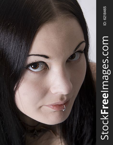 Portrait of a young woman with long black hair. Portrait of a young woman with long black hair