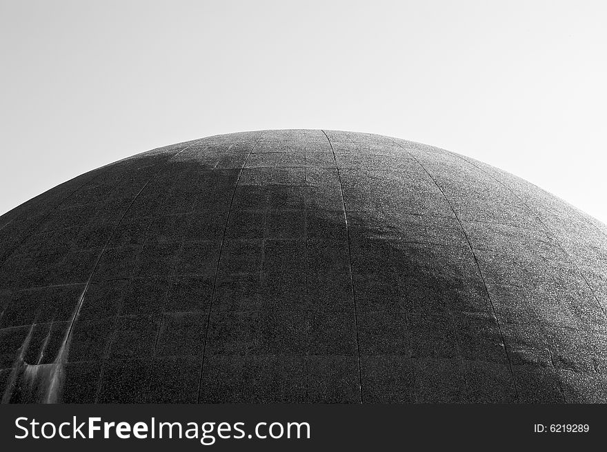 Large cement dome half in sunshine in black and white. Large cement dome half in sunshine in black and white