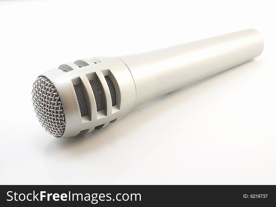 Silver microphone on a white background