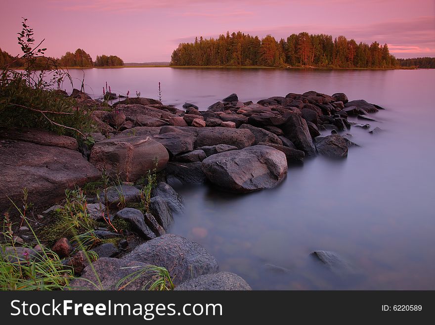 Sunset by the lake, rocks, long exposure