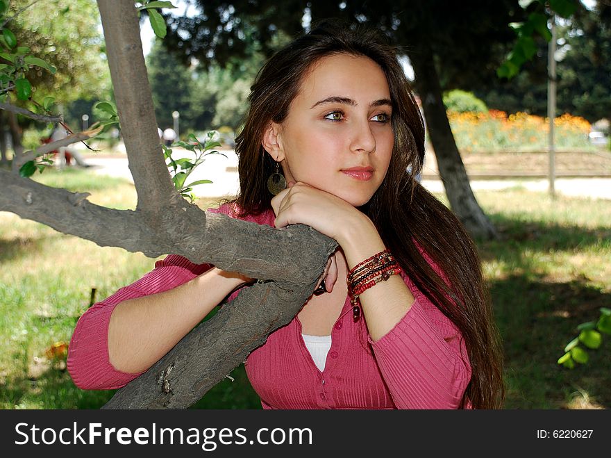 Young girl relaxing in the park. Young girl relaxing in the park