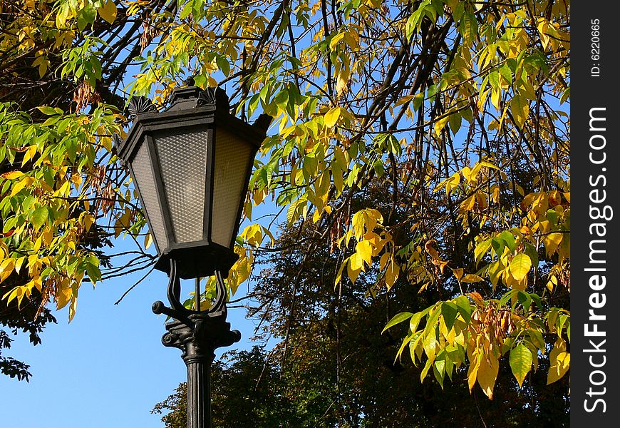 The Old-time torch in autumn park