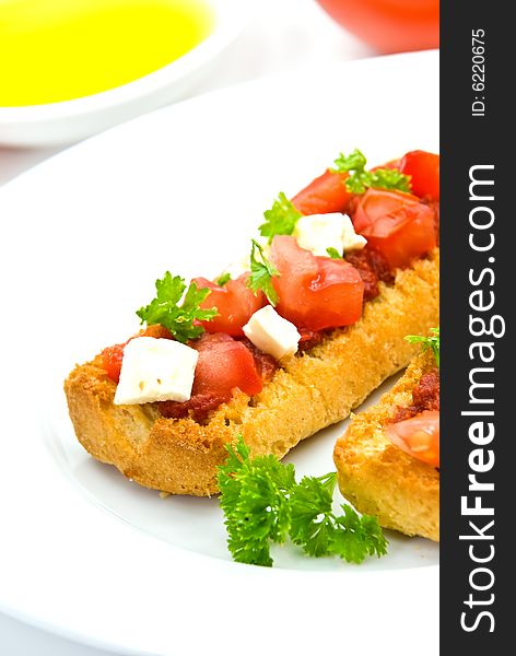 Bruschetta with tomato,cheese and other stuffing.