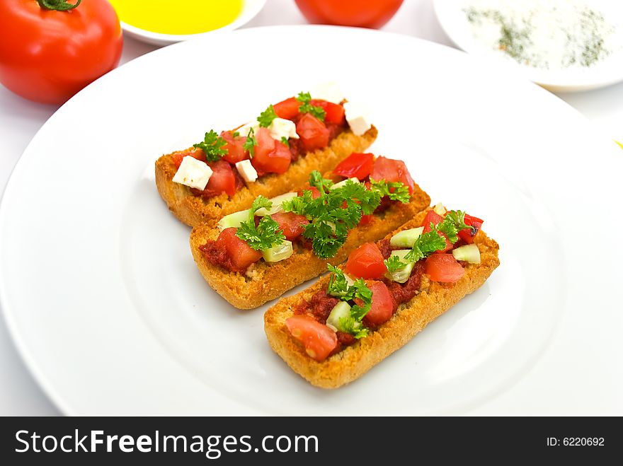 Bruschetta with tomato,cheese and other stuffing.