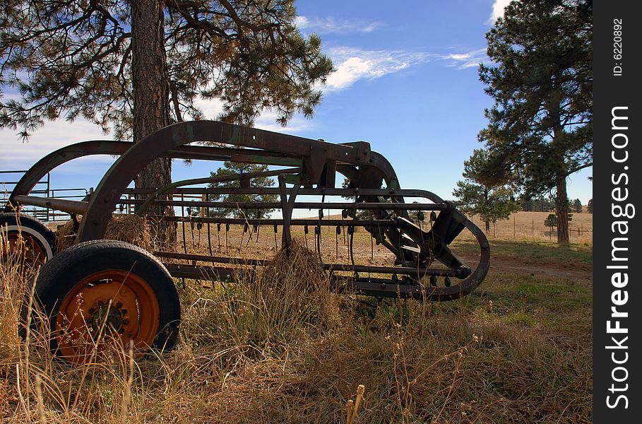 Old Rusty Antique Tractor Sitting in a Field