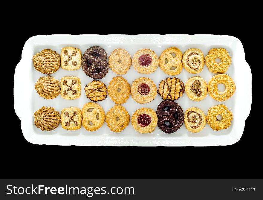 A white tray with an assortment of different kinds of teacakes