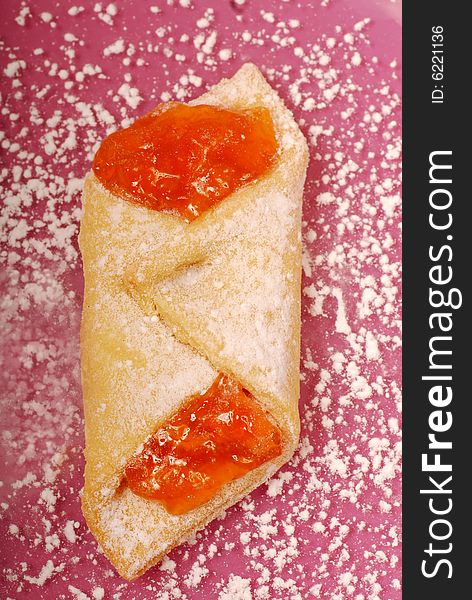 Overhead view of apricot kolache on a plate