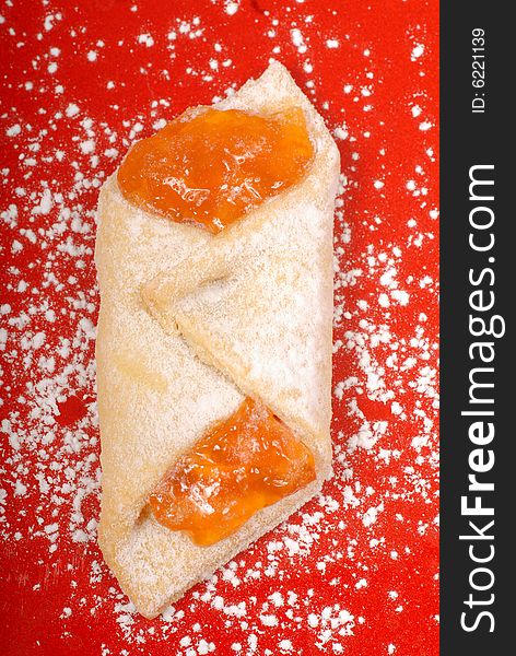 Freshly baked apricot kolache with powdered sugar