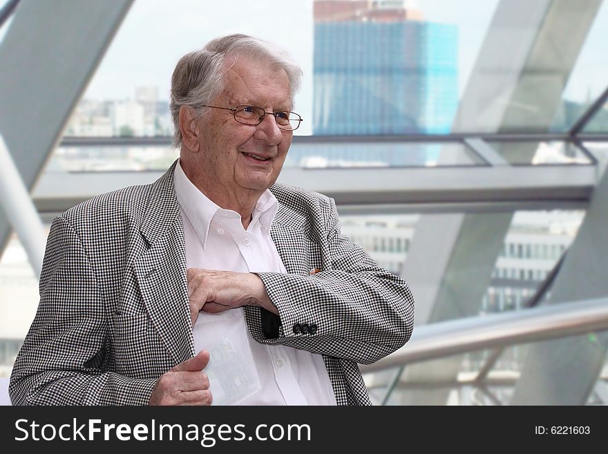 Portrait of a senior businessman smiling. Portrait of a senior businessman smiling