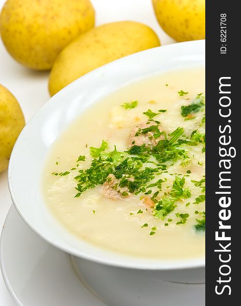 Potato cream soup with chopped meat balls.