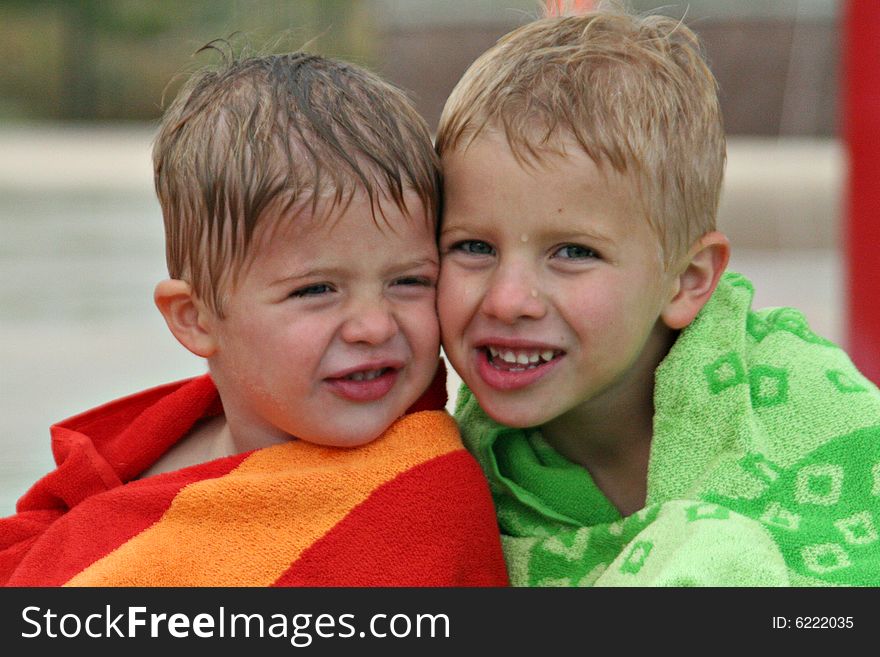 Wet Brothers Cheek to Cheek After Swimming. Wet Brothers Cheek to Cheek After Swimming