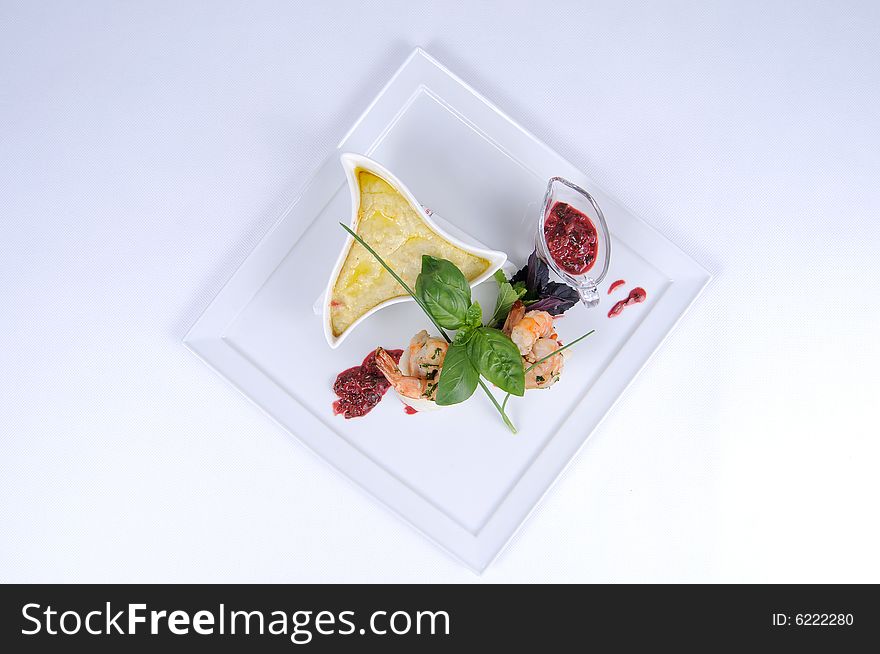 Plate of fine dining meal, halibut with vegetables