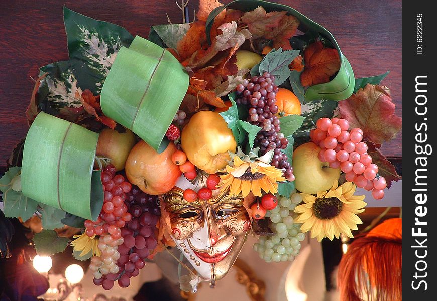 Mask with fruits and flowers still live. Mask with fruits and flowers still live