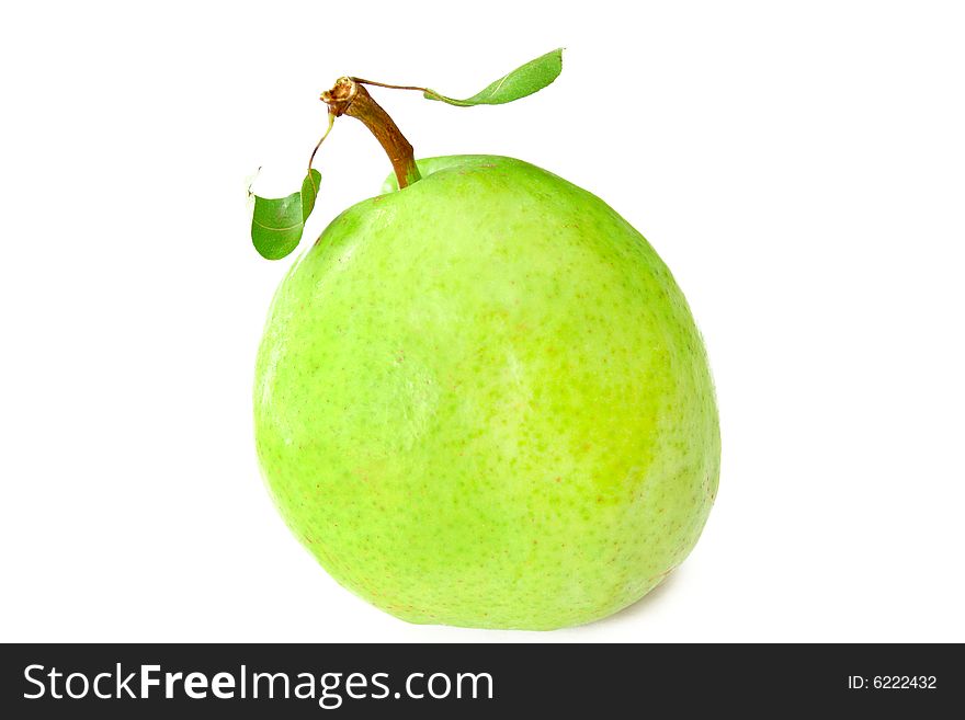 A fresh pear with leaves isolated on a white background.