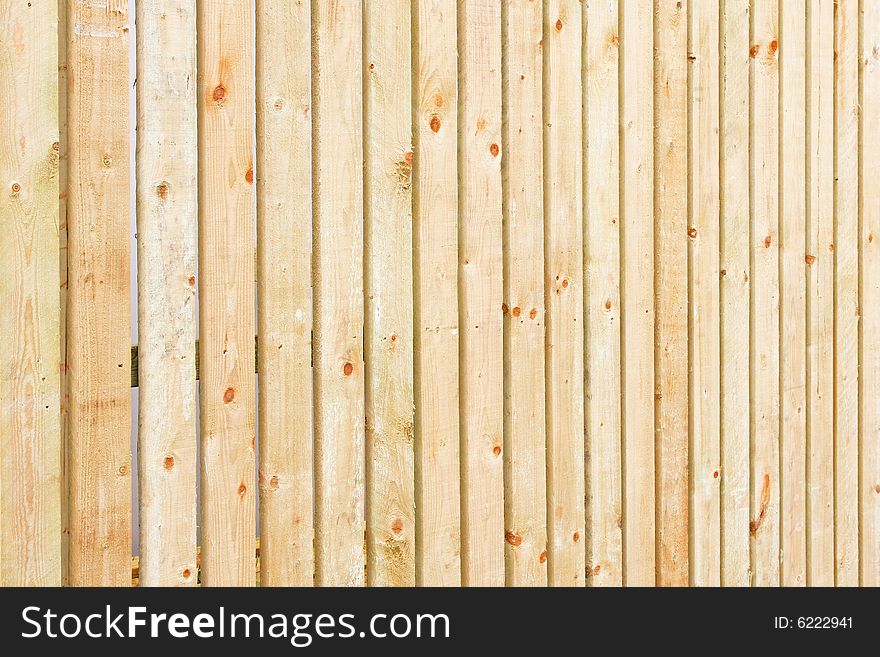 Background made from light wood fence barrier. Background made from light wood fence barrier