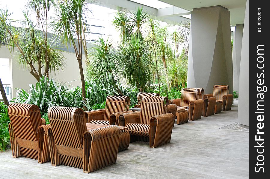 Business patio with curved wooden table and chairs