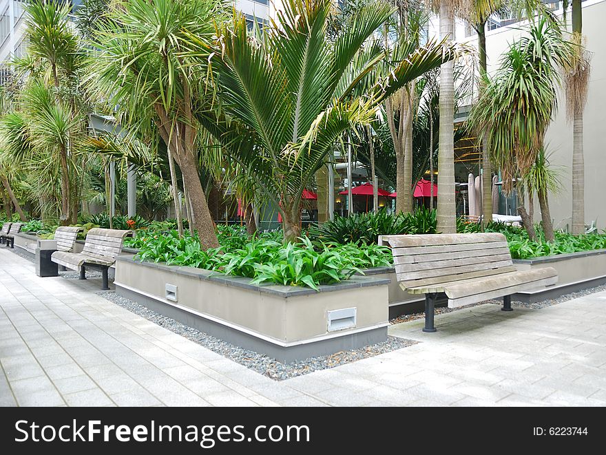 Business patio with curved wooden table and chairs